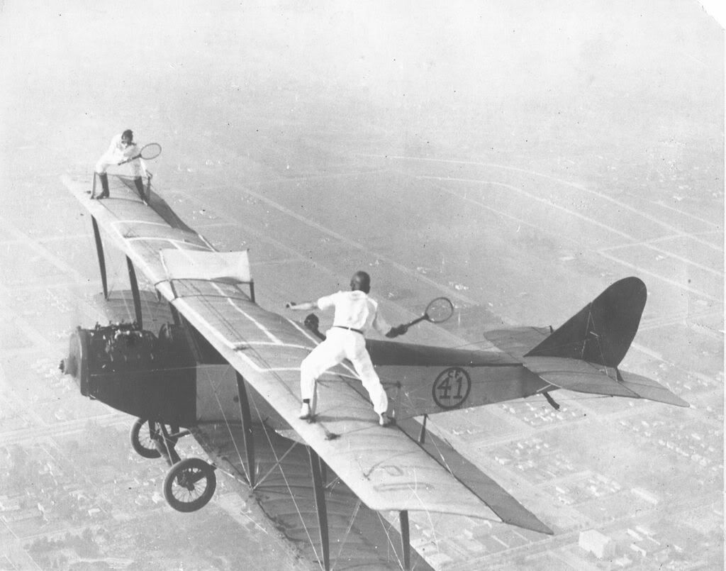 roosfld033playingtennisonbiplanewin.jpg