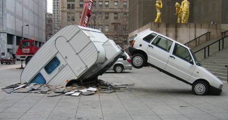 car-crashes-trailer-through-sidewal.jpg